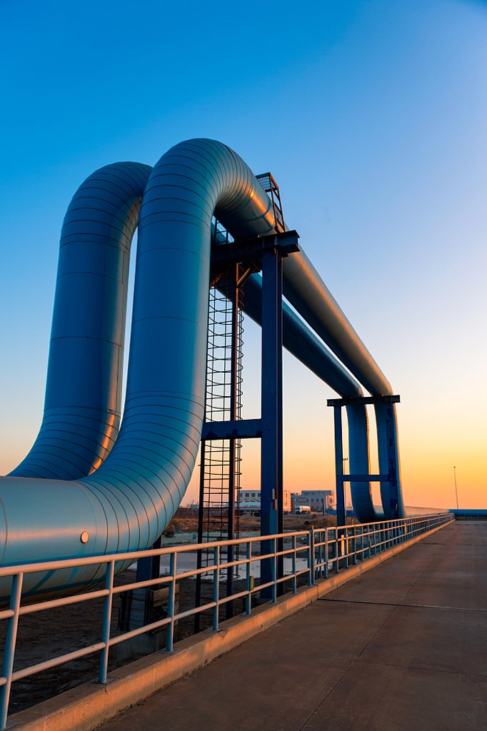 blue pipes going to oil refinery